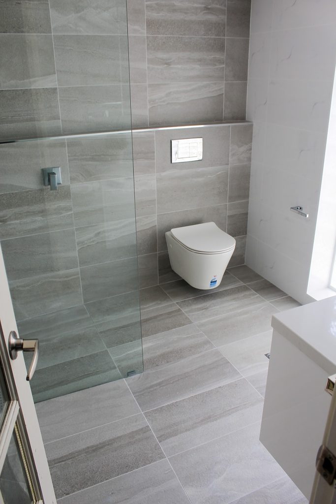 after-bathroom-reno-grey-tiles-floating-toilet